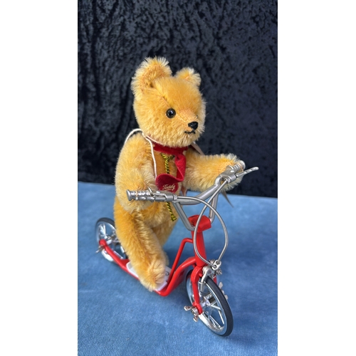 401f - Hermann limited edition no 665/1000 miniature teddy bear on a red metal scooter. Bear approx 17cm ea... 