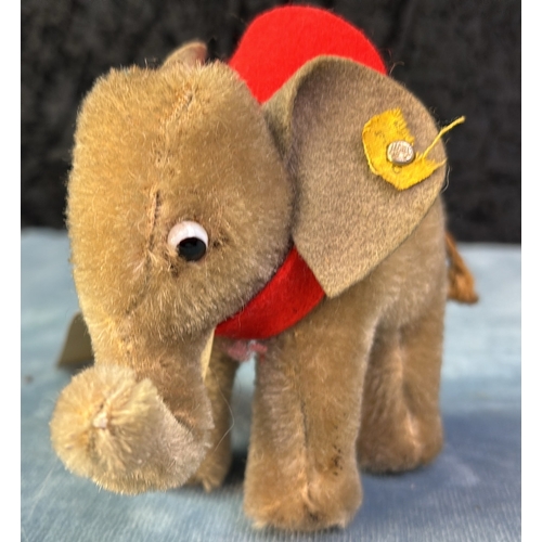 401h - Steiff mini elephant with positionable trunk. Vintage c1960s. Mohair fur with string tail. Damage to... 