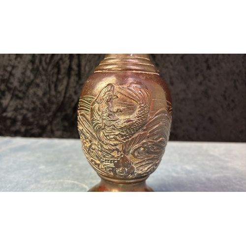 417 - Fine Chinese bronze baluster vase decorated in high relief. One side depicting tempestuous seas and ... 