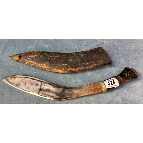 424 - A kukri knife with decorated hilt and leather sharhe, blade length approx 30cm