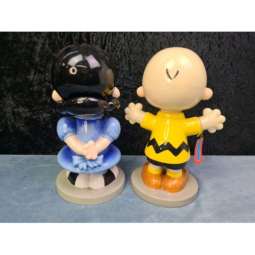 435 - Westland Peanuts large Charlie Brown and Lucy figurines, approx 29cm tall with tags