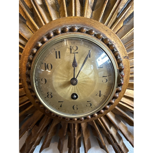 457 - Fabulous vintage sunburst clock (no key, some chips and one split, see photos), approx 44cm x 75cm