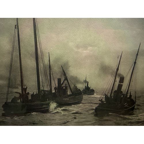 458 - Framed print of North Sea fishing trawlers, frame measures approx 43cm x 57cm