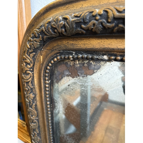 464 - Antique wall hanging mirror in elaborate gilt frame, some loss to silvering, frame approx 97cm x 71c... 