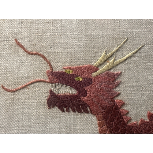 472 - Framed needlework hand embroidery of a dragon, frame approx 33cm x 53.5cm