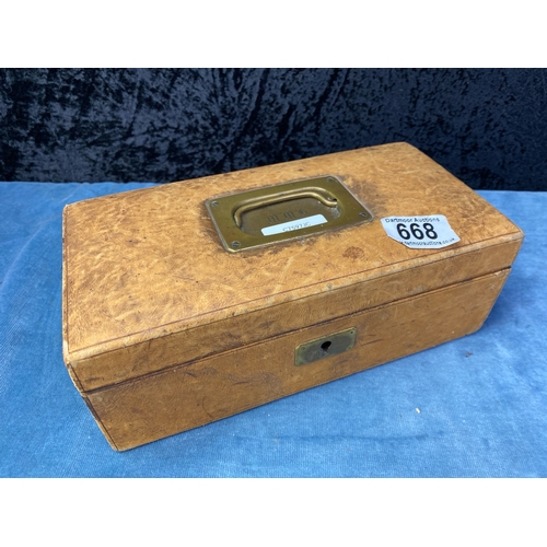 668 - An absolutely top class vintage jewellery box, in tan suede with brass handle and internal tray, ful... 