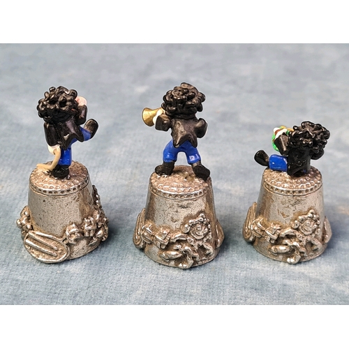 689 - Three Golly Musicians pewter thimbles.