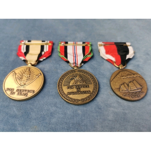 696 - Collection of 3 US Army Campaign Medals: for Service in Afghanistan, Japan and Iraq.