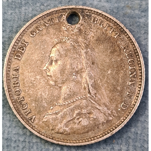 731 - Queen Victoria silver shilling with hole. Very fine 1887