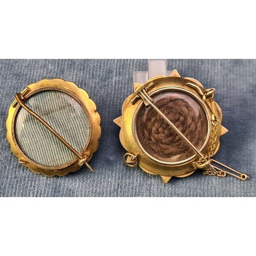 758 - Two antique yellow metal mourning brooches/lockets - one with braided hair.