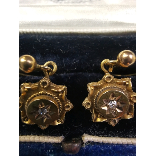 771 - Lovely pair of screw-in 15 carat gold earrings with a diamond in each one. Original W Brufords leath... 