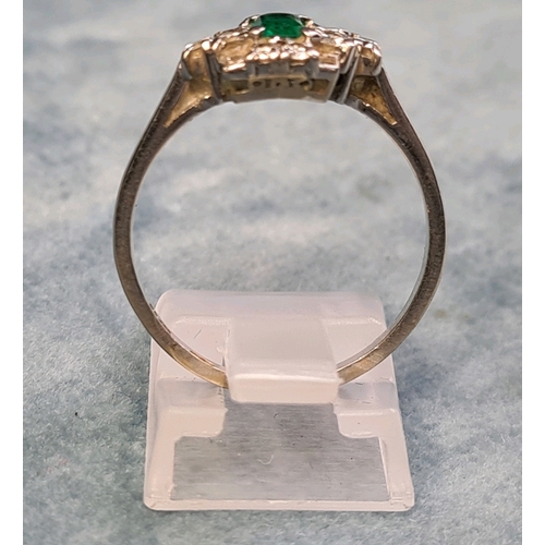 772 - Beautiful emerald and diamond platinum ring. Size Q