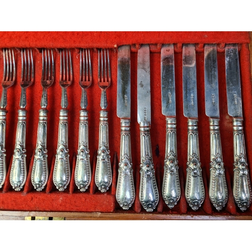 779 - A 2 layered wooden canteen of 36 Georgian silver knives and forks (two knives as found). Sheffield 1... 