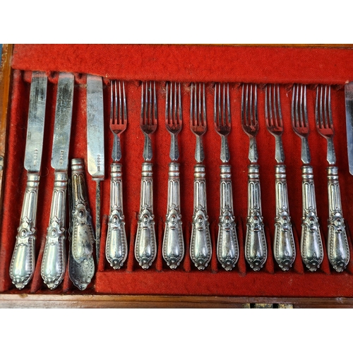 779 - A 2 layered wooden canteen of 36 Georgian silver knives and forks (two knives as found). Sheffield 1... 