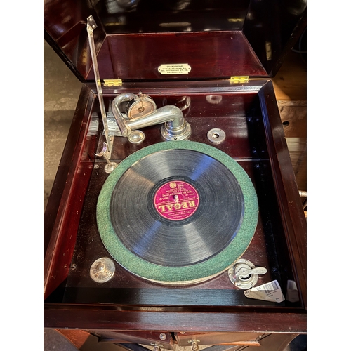 795 - A pretty mahogany gramophone complete with winding handle, spare needles and a variety of records.  ... 