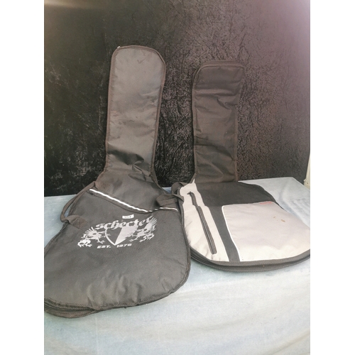 954 - And to finish, 2 padded guitar cases 1 Stagg, the second Schecter