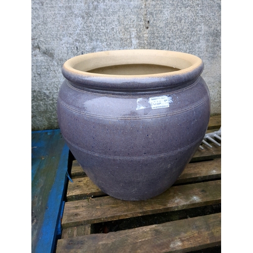 1011A - 1 large glazed stoneware circular garden pot and a smaller tall decorative squared glazed pot