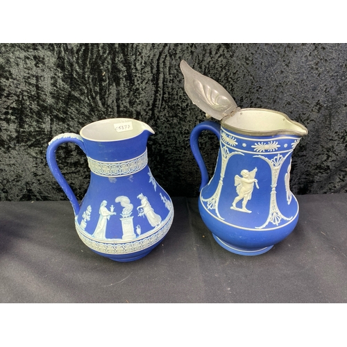 256 - Pair of Wedgwood 19th Century Royal Blue Jasperware Pitchers, one with pewter lid