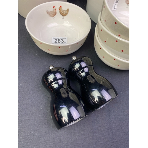 283 - Kitchenware items Inc chicken embellished bowls, two large ceramic McDougall's Flour pots and black ... 