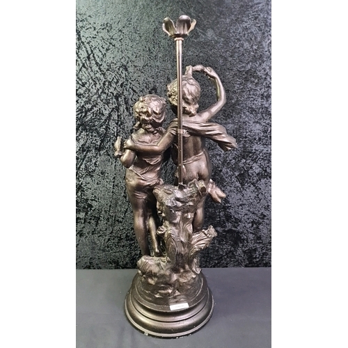 36 - Large spelter statue depicting a boy and girl in the style of Auguste Moreau, 63cm tall