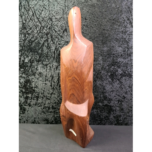 39 - Wooden sculpture of a lady’s figure by local artist Pat Johns, 47cm tall