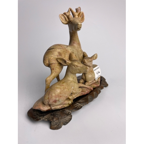 406 - Soapstone carving of a deer with fawns on a wooden stand