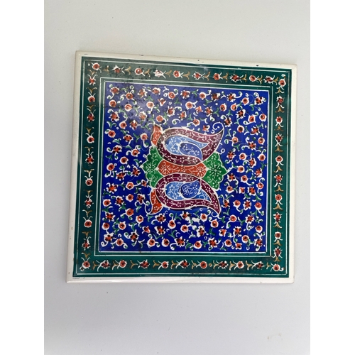 411 - Seven decorative painted Iranian tiles