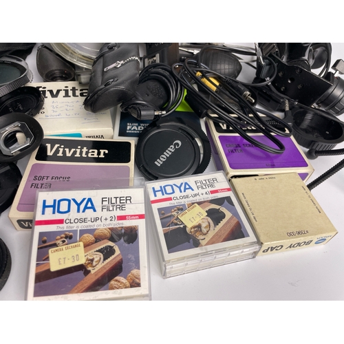 454 - Large collection of camera parts and accessories inc Canon, Haisser etc