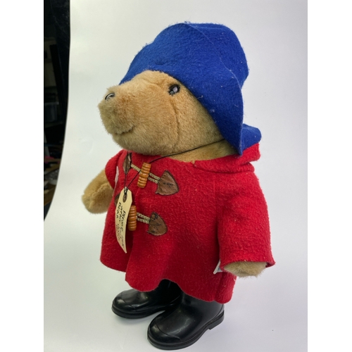 457 - 1991 Paddington Bear with felt hat and coat and black wellies by Eden, approx 38cm hat to boot.