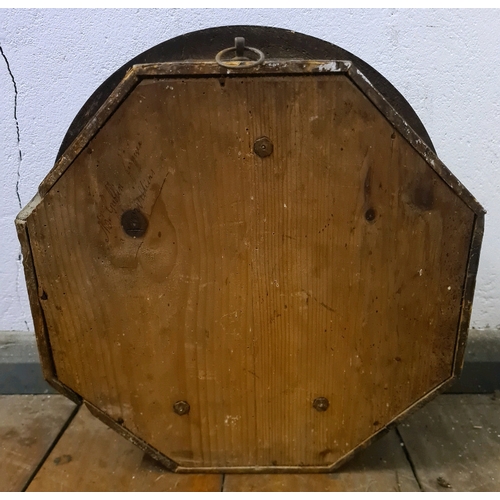 459 - Wooden cased circular wall clock with pendulum and key. Measuring approx 38cm diameter