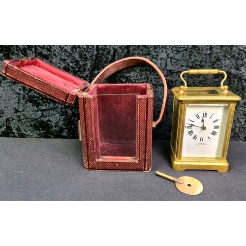 49 - Emanuel, Southampton French made brass carriage clock with key in glass fronted carry case