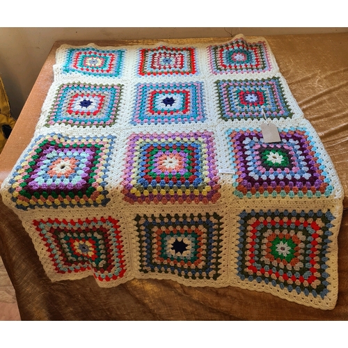 521 - Lovely crocheted blanket. Measuring approx 144cm by 106cm.