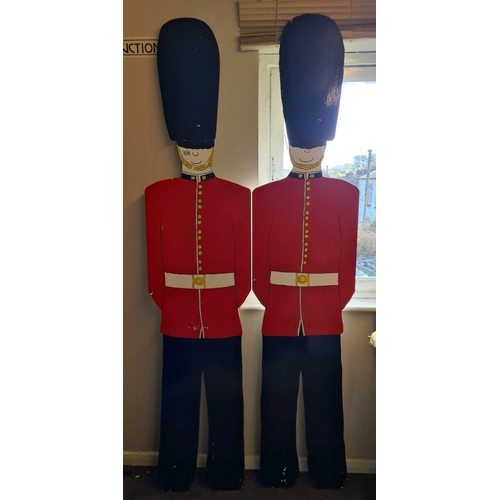 528 - Two handmade and hand painted wooden Grenadier Guards (212cm tall) with a wooden Corgi and a large s... 