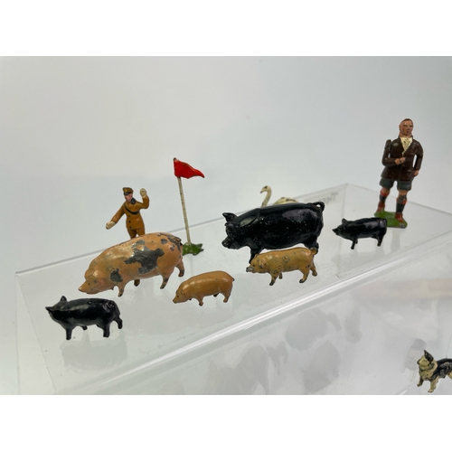 634 - Collection of vintage cast lead farm animals in Zebra, sheep, pigs, fab turkey and figure