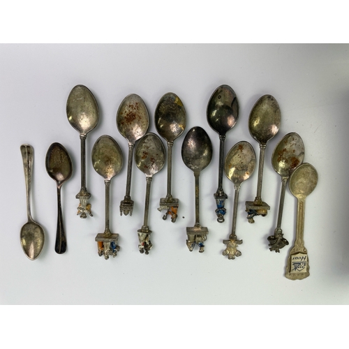 670 - Collectible spoons with a religious theme inc 2 silver spoons