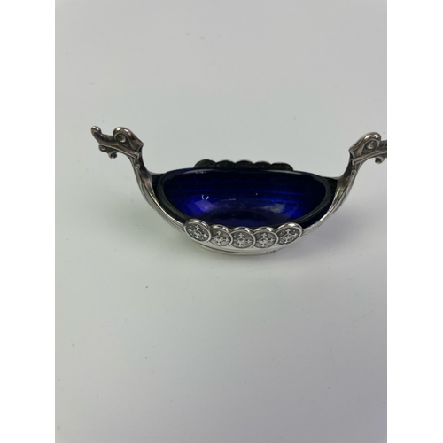 674 - A pretty Sterling Silver marked Viking boat condiments dish with blue glass liner, a very unusual Ha... 