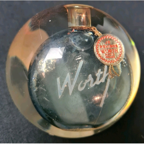 689a - An unusual Lalique etched Je Reviens perfume bottle, with original Worth tag, encased in paperweight