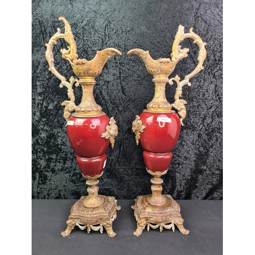 7 - Pair of antique French ornamental ewer jugs with claret red ceramic body and gilt / possibly ormolu ... 