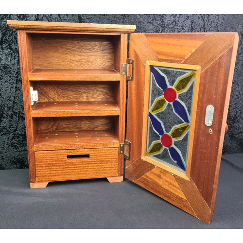 70 - Small wooden tabletop cupboard with internal shelves and drawer and stained glass panel, 41cm x 28cm... 