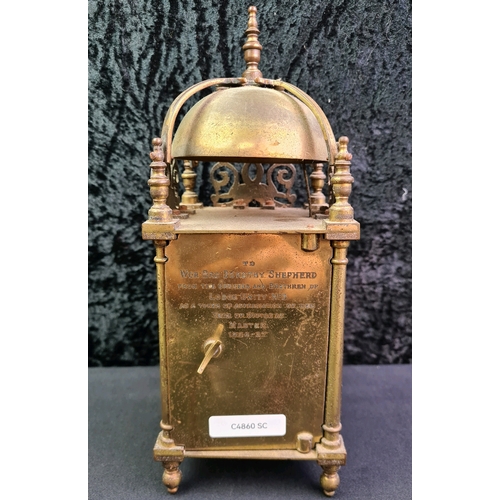 725 - Astral brass clock from the estate of Dorothy Shepherd with inscription to back - ‘To Wor. Bro. Doro... 