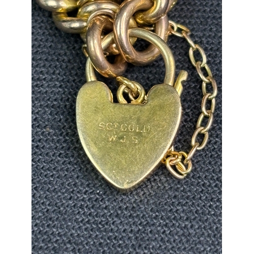 760 - Beautiful 9ct gold charm bracelet with padlock, safety chain and  approx 24 different gold charms. 4... 