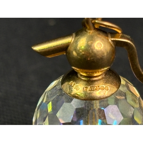 786 - Unusual 9ct gold pendant charm with glass crystal in the form of a soda symphony.