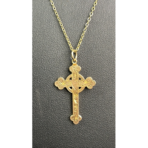 789 - Decorative 9ct gold cross and chain. 44 cms long. 2 gms.