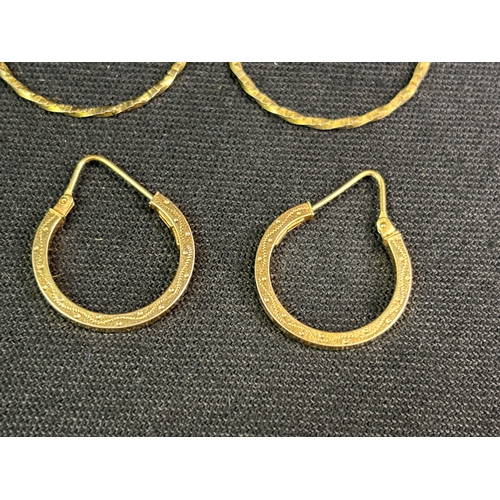 796 - Pretty pair of 9ct gold earrings and a larger yellow metal pair.