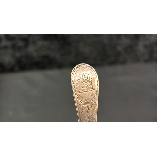 876 - Late Georgian fancy dessert spoon with elephant cypher. London 1823 35 gms.