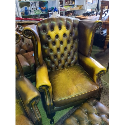 913 - Pair of classic wingback Chesterfield chairs with matching footstools.  W90cm x D90cm.