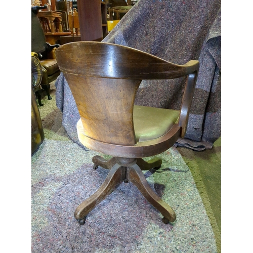 916 - Vintage wooden and leather rocking banker's/office swivel chair on original brass castors.