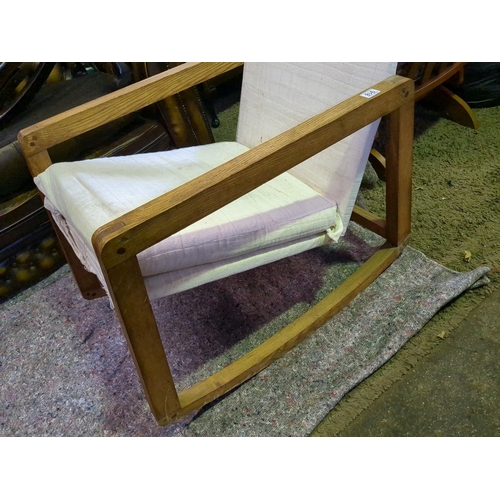 918 - Mid century, possibly Scandinavian, designer oak rocking chair with linen upholstery to seat and bac... 