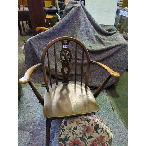 919 - Small Ercol Windsor back armchair with upholstered seat pad.