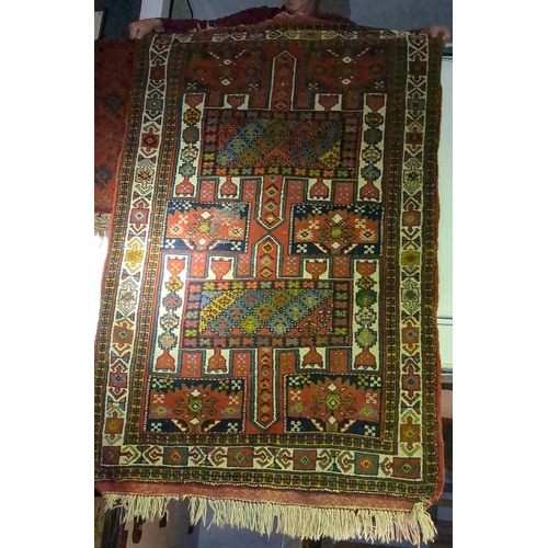 920a - Two rugs with red, orange and grey geometric designs, measure approx 192cm x 117cm and 208cm x 130cm... 